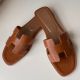Hermes Oran Slide Sandals In Gold Swift Calfskin